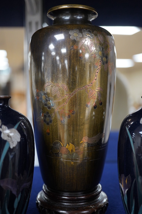 A Japanese presentation bronze and mixed metal vase on hardwood stand and a pair of cloisonne enamel vases (3), tallest 20cm. Condition - fair to good